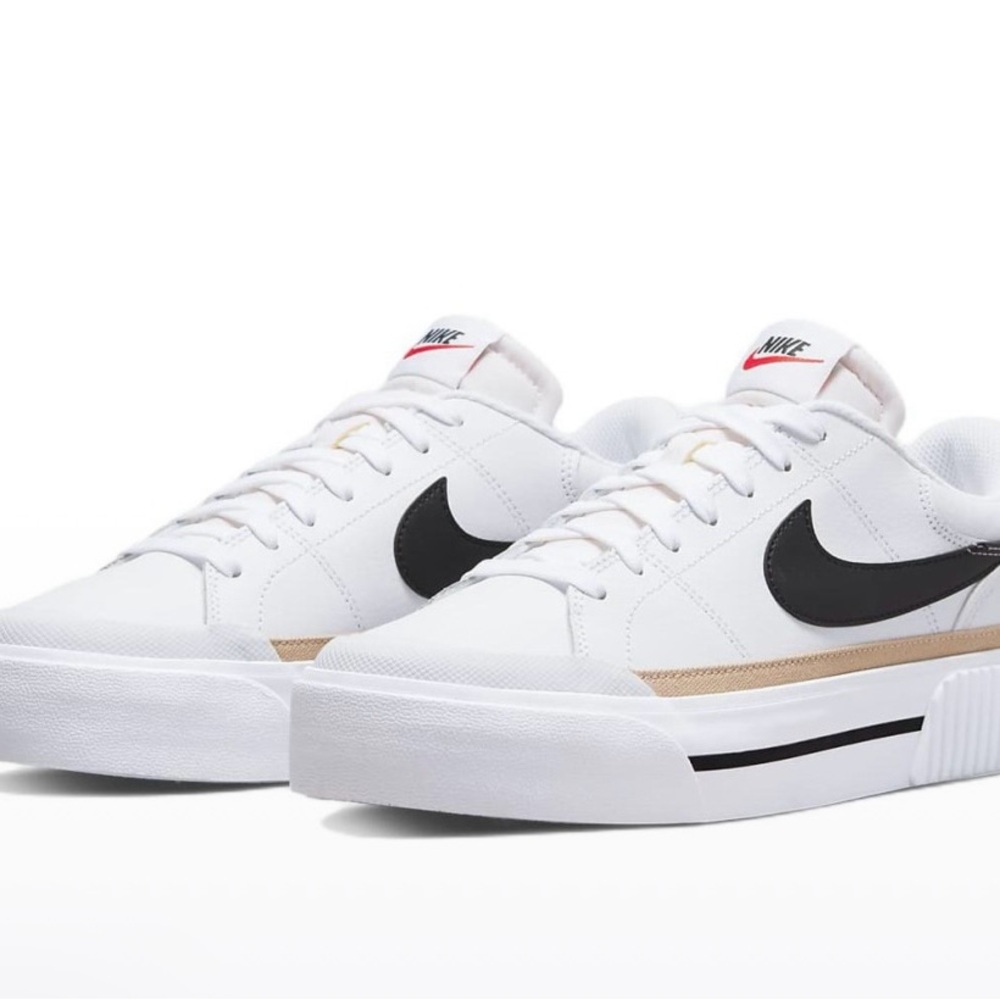 Nike Women’s White Platform Sneakers with Black Swoosh and Gold Accent